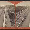 Looking across top of R.R. Bridge, Portage, N.Y., toward Depot.