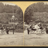 Sharon Springs, N.Y. [View of women on horse-drawn carts. Magnesia Temple in background.]