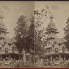 Residential building, people gathered on porch, horse-drawn carriage in foreground.