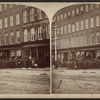 View of Barnard & Sons, and other stores in Utica.