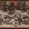A couple relaxing on logs in Watkins Glen.