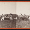 View of military men and ladies around a cannon.