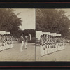 Soldiers with rifles standing in row.