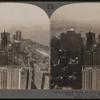 Looking Down on New York's Skyscrappers -- From Woolworth Tower (S.W.) Over Battery to Statue of Liberty and Harbor.