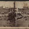 [Scenery view of buildings, horse carriages and trolley.]