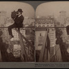 Photographing New York City - on a slender support 18 stories above pavement of Fifth Avenue[man with a camera].