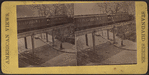 View of elevated railway with train.