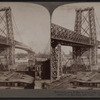 New steel tower bridge (1 1/3 mile long, 1600 feet between piers) From Manhattan E. to Brooklynm,