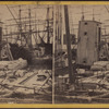 Looking along the docks, from Fulton Market, showing floating grain elevators.