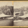 View of a tent and Bow Bridge in distance.