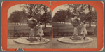 Drinking fountain on the mall. [Girl in a dress at the fountain.]