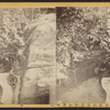 View of two men sitting on a bench.