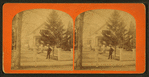 Group of people in the garden in front of their home.