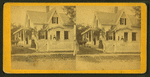 Women and children shown on porches. (A boy holds a horse).