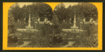 View of a garden with a fountain.
