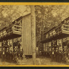 A group posing on porch and balcony at campground or resort.