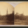 General view with churches, trees, and a fountain.