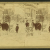 Children in the winter in front of a house.