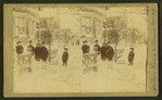 Children in the winter in front of a house.