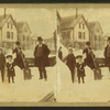 View of a family in a residential neighborhood in the winter after a major snowstorm.