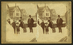 View of a family in a residential neighborhood in the winter after a major snowstorm.