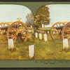 Rustic seat, old cannon and graves, Dayton soldier's home.