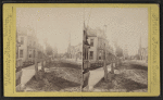 Congress Park, Bradford, Pa. [View down a street lined with row houses, oil derrick at the end of the street.]