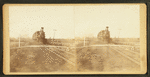 Railroad train on track in level countryside.