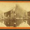 Shuman. [Two men fishing off a dilapidated deck.]