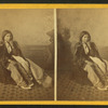 Studio portrait of a young Native American woman in tradtional clothing.