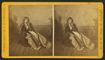 Studio portrait of a young Native American woman in tradtional clothing.