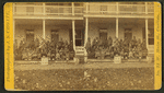 Group portrait of Native American students on the steps of the United States Indian Industrial Training School.