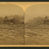 This view is looking toward the corners of Main and Clinton Streets, and shows the remains of the only buildings left standing on the one side of Clinton Street; also where stood the ill-fated Hulbert House where so many commercial men lost their lives.