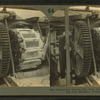 Emptying cooled pig iron from molds into car, pig iron machine, Pittsburg, Pa.