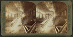 Steel works, Pittsburgh, Pa., beam of hot iron in rolling mill, drawn out [00?] feet long.