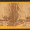 View of ice-covered building at scene of the burning of the building.