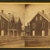 [A clapboard house with gingerbread trim.]