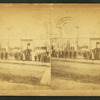 Group in front of unidentified business.