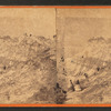 View of people climbing the cliff.