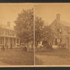 Group of people in front of a home, Block Island, some playing croquet, child on tricycle.