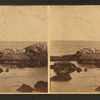 View of rock formation in the ocean.
