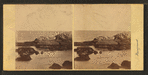 View of rock formation in the ocean.