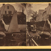 House and beached sailboats.