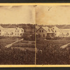 View of family residences and empty lots.