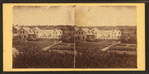 View of family residences and empty lots.