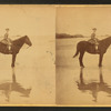Girl on horseback in the beach.
