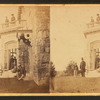 Family posing in front and in the balcony of stone house.