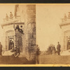 Family posing in front and in the balcony of stone house.