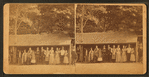 Group of people lined up in front of an 'Eating Saloon.'
