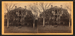 View of a large house with civil and military personnel on porches.